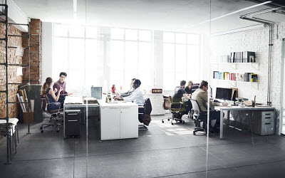 shot of modern office with team members at work