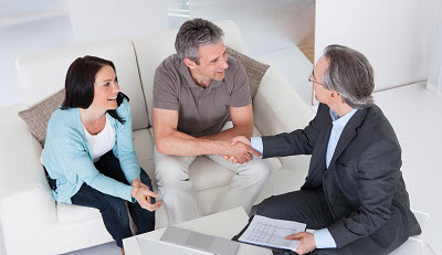 real estate agent meeting with couple