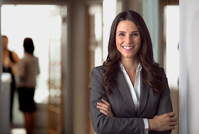 smiling business woman in office background